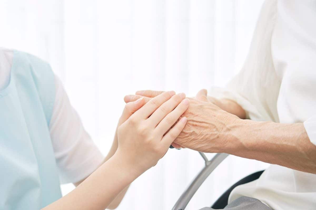 Asian,Caregiver,Holding,Asian,Senior,Woman’s,Hands,,No,Face