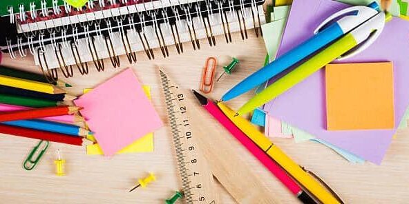 School and office accessories on wooden background